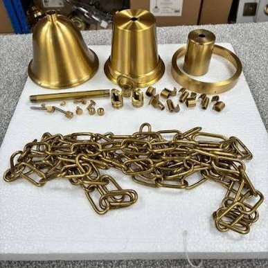 Brass plated metal bells and structural chains